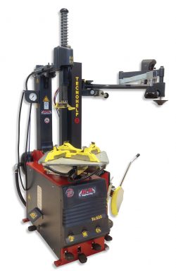 How does a tire changer machine remove a tire?