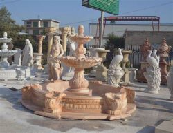 Pink marble outdoor water fountain