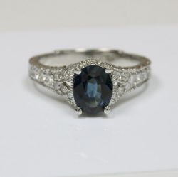 Oval Cut Blue Sapphire Prong Set Ring With Round Diamonds